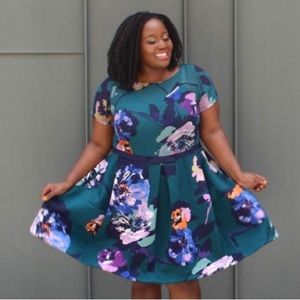 Taylor teal a-line dress with abstract floral print and sheer illusion neckline